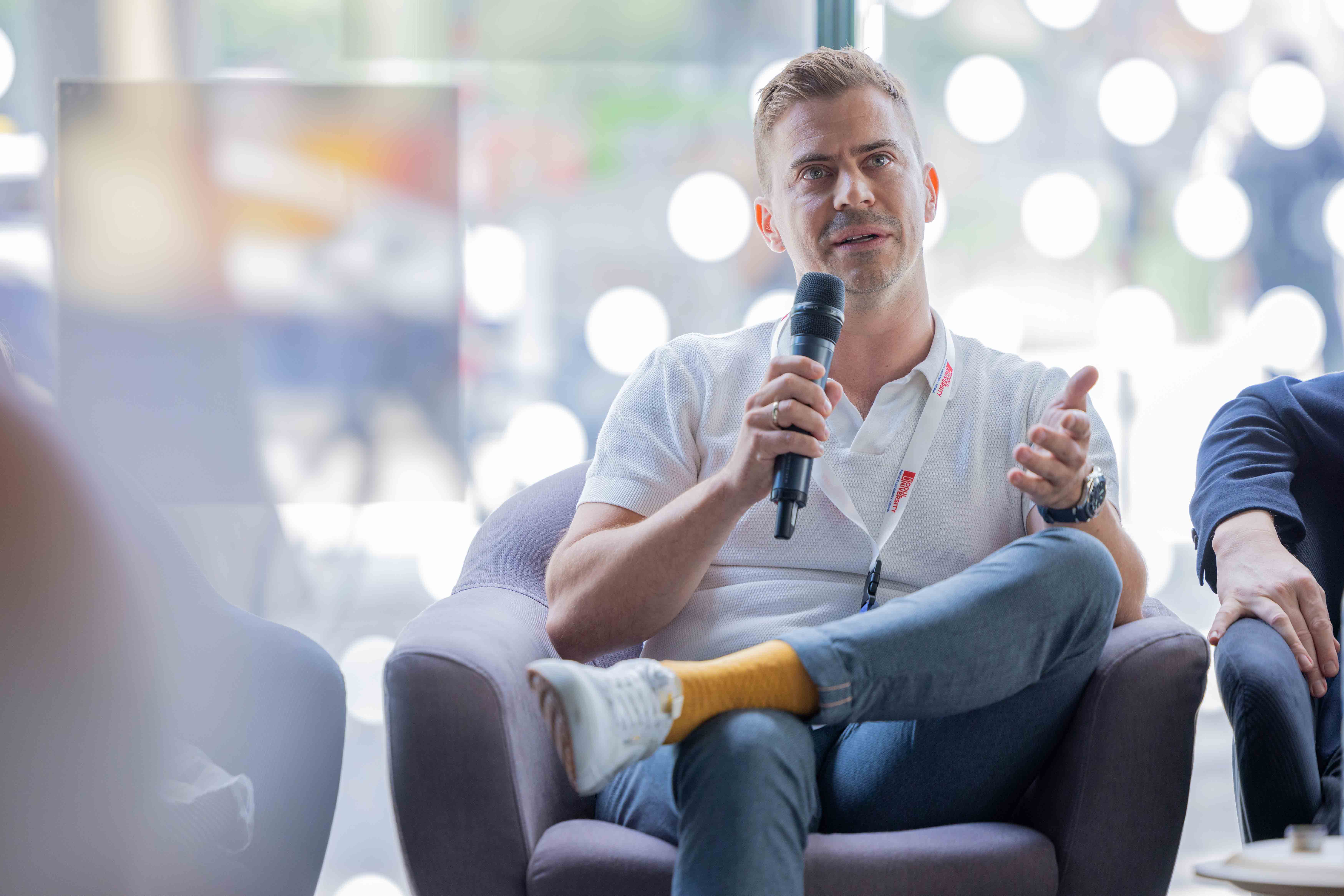 Greg Romhány speaking on a panel