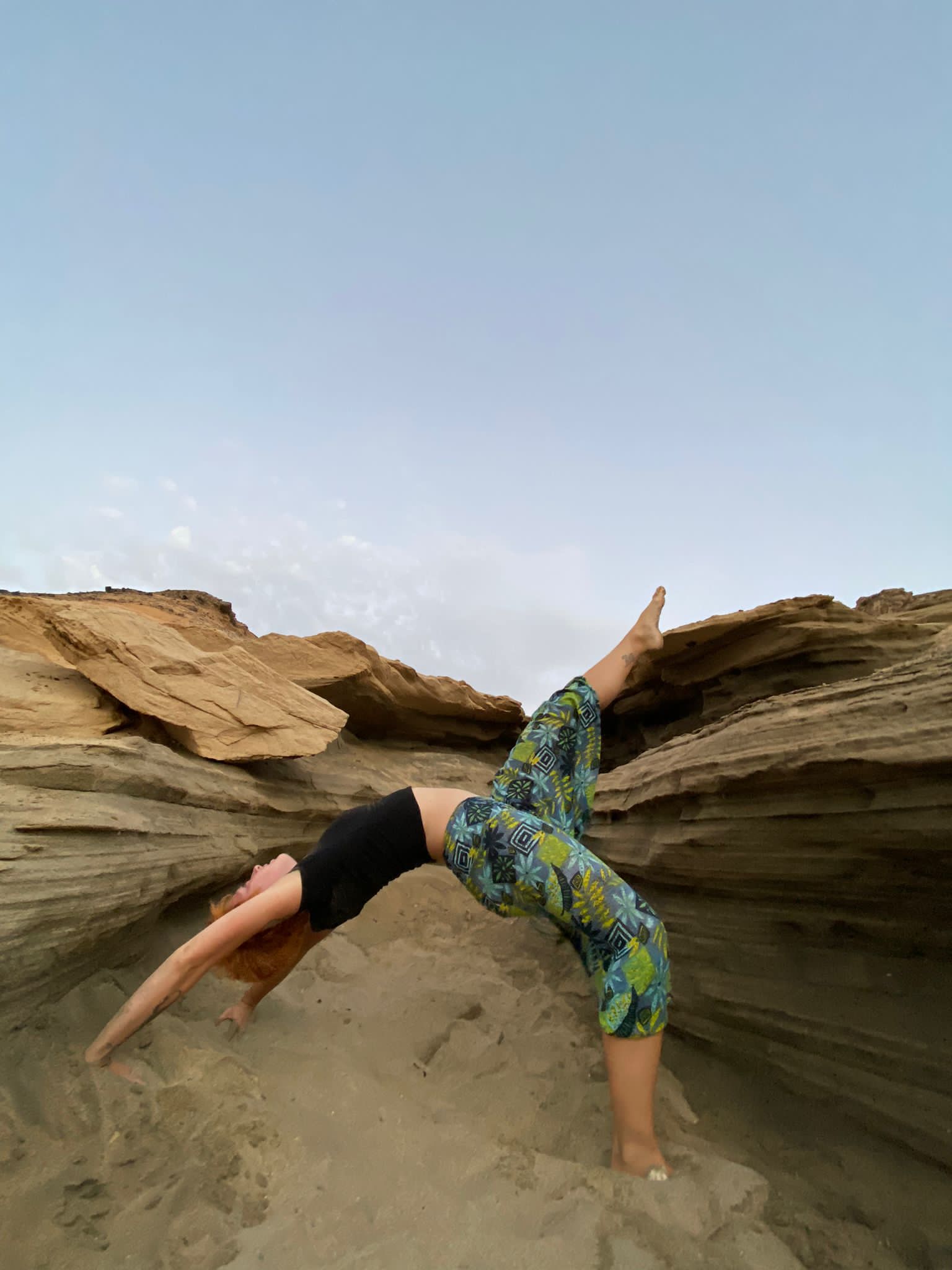 Sarah yoga on the rocks